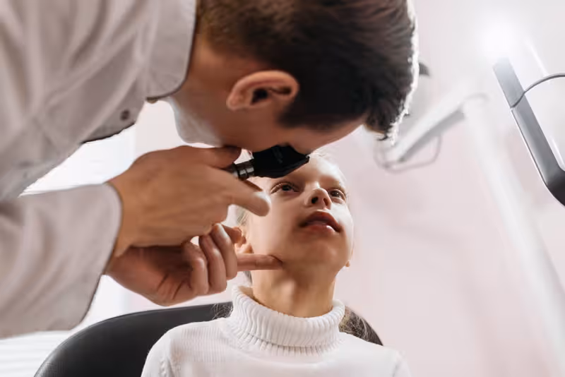 Book Your Microsuction Ear Wax Removal Appointment Today, And Say Goodbye to the Discomfort of Ear Wax.: A doctor in a clinic Doctor in clinic for Book Your Microsuction Ear Wax Removal Appointment Today, And Say Goodbye to the Discomfort of Ear Wax...