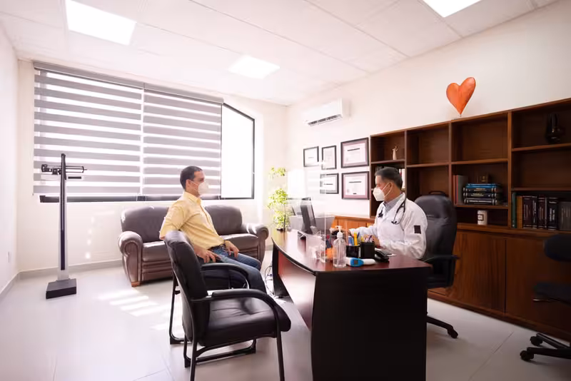 Book Your Microsuction Ear Wax Removal Appointment Today, And Say Goodbye to the Discomfort of Ear Wax.: A doctor in a clinic Doctor in clinic for Book Your Microsuction Ear Wax Removal Appointment Today, And Say Goodbye to the Discomfort of Ear Wax...